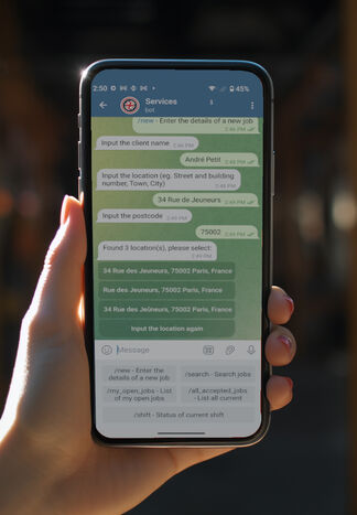 Close up of mobile phone screen with telegram bot